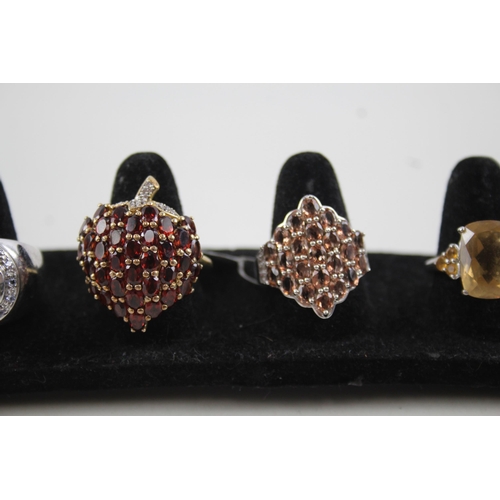 2118 - Five sterling silver gemstone set rings to include ruby, garnet, citrine etc. - approx. gross weight... 