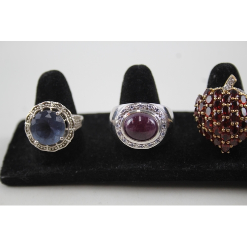 2118 - Five sterling silver gemstone set rings to include ruby, garnet, citrine etc. - approx. gross weight... 