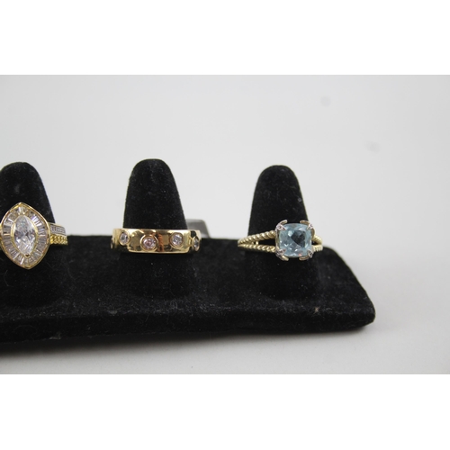 2121 - Six .925 gilt silver gemstone set rings to include CZ, topaz, garnet etc. - approx. gross weight 18g