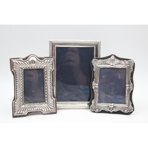 2208 - Three hallmarked sterling silver photo frames - largest approx. 16cm high x 12cm wide