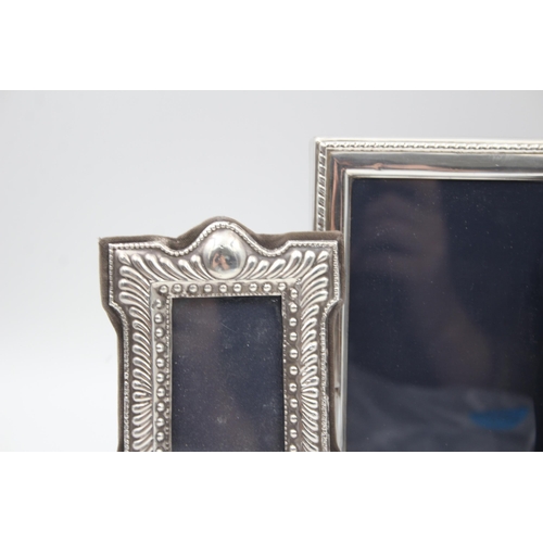 2208 - Three hallmarked sterling silver photo frames - largest approx. 16cm high x 12cm wide