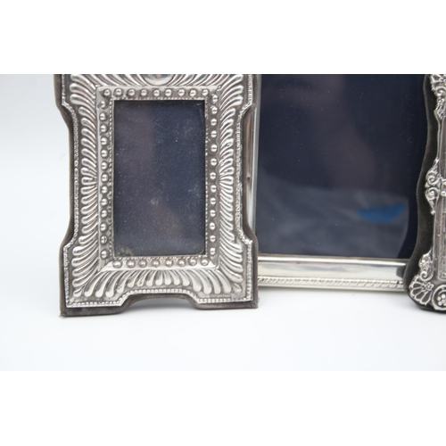 2208 - Three hallmarked sterling silver photo frames - largest approx. 16cm high x 12cm wide