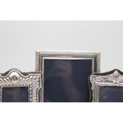 2208 - Three hallmarked sterling silver photo frames - largest approx. 16cm high x 12cm wide