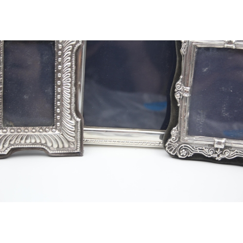 2208 - Three hallmarked sterling silver photo frames - largest approx. 16cm high x 12cm wide