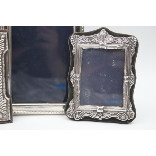 2208 - Three hallmarked sterling silver photo frames - largest approx. 16cm high x 12cm wide