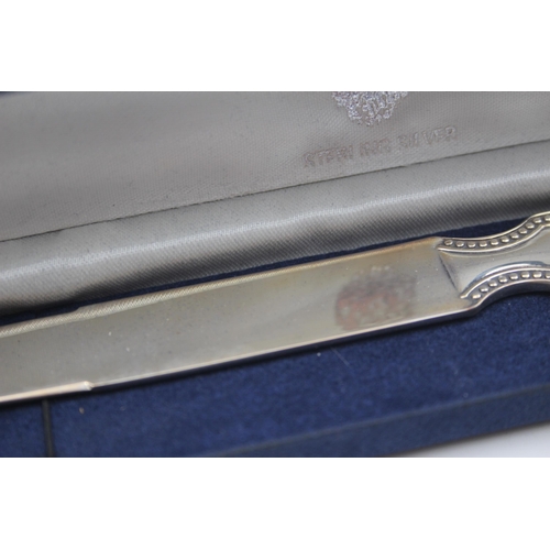 2222 - A boxed hallmarked sterling silver letter opener - approx. gross weight 59g