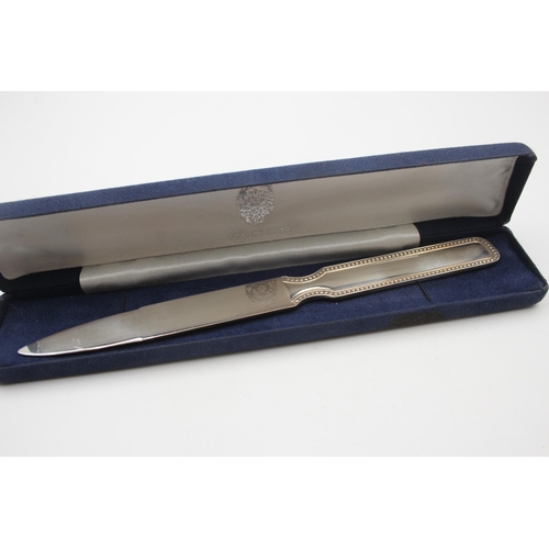 2222 - A boxed hallmarked sterling silver letter opener - approx. gross weight 59g