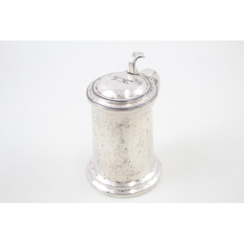 2251 - An Alfred Dunhill silver plated tankard table lighter