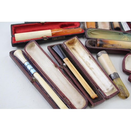 2252 - Twelve cheroot holders to include silver banded meerschaum, amber etc.