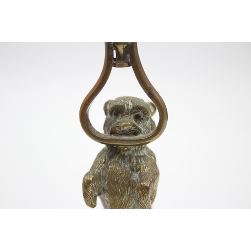 2256 - A vintage brass novelty terrier dog candlestick - approx. 16.5cm high