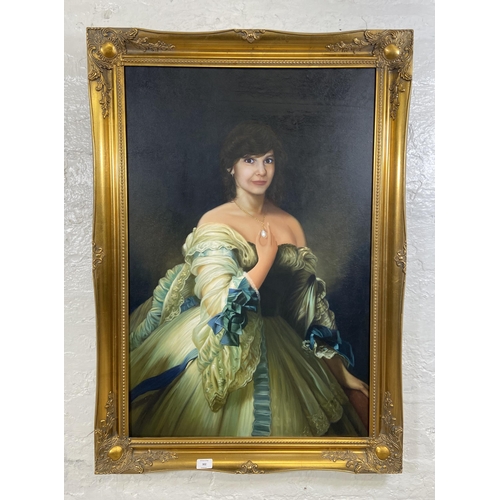 234 - A modern gilt framed oil on canvas portrait of a lady - approx. 106cm high x 75cm wide