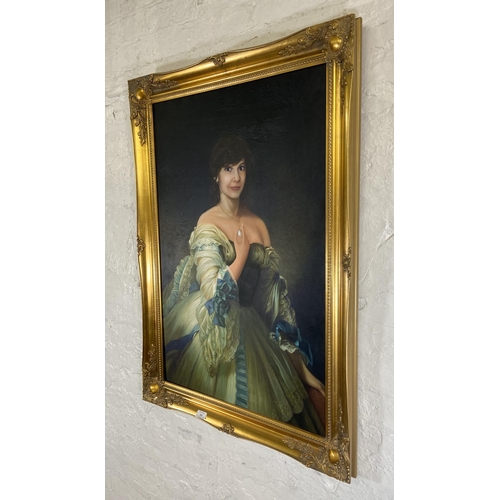 234 - A modern gilt framed oil on canvas portrait of a lady - approx. 106cm high x 75cm wide