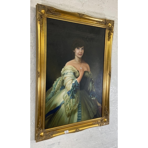 234 - A modern gilt framed oil on canvas portrait of a lady - approx. 106cm high x 75cm wide