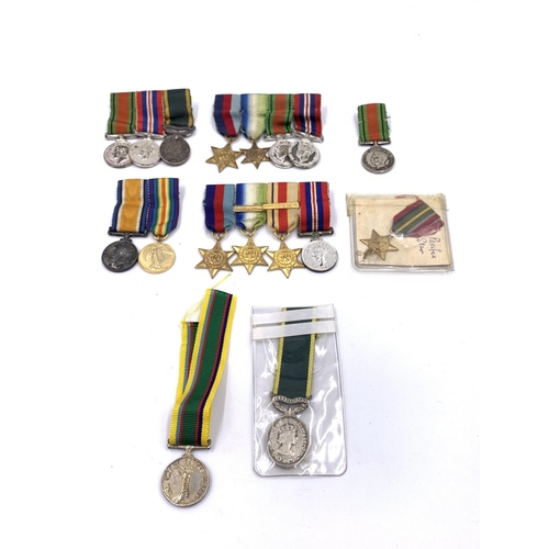 2308 - A collection of miniature British medals to include WWI War, Pacific Star, Victory etc.