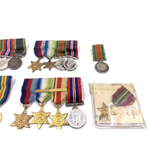 2308 - A collection of miniature British medals to include WWI War, Pacific Star, Victory etc.