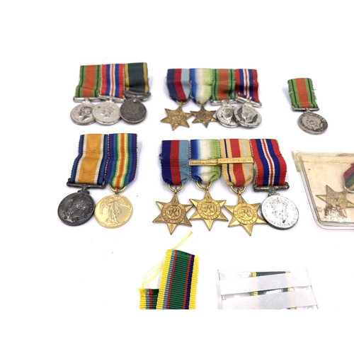 2308 - A collection of miniature British medals to include WWI War, Pacific Star, Victory etc.