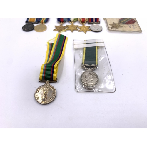 2308 - A collection of miniature British medals to include WWI War, Pacific Star, Victory etc.