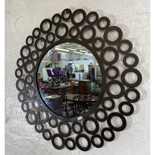 219 - A modern metal circular decorative wall mirror - approx. 68cm in diameter