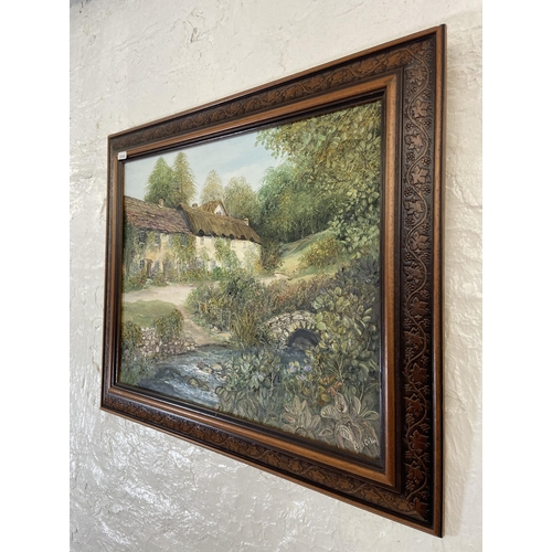 231 - A 20th century framed Ann Cellia oil on board of a village scene - approx. 51cm high x 61cm wide