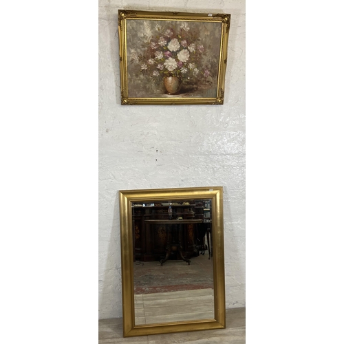 235 - Two items, one modern gilt framed bevel edge wall mirror and one mid 20th century gilt framed oil on... 