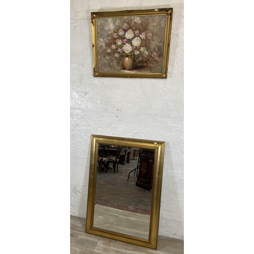 235 - Two items, one modern gilt framed bevel edge wall mirror and one mid 20th century gilt framed oil on... 