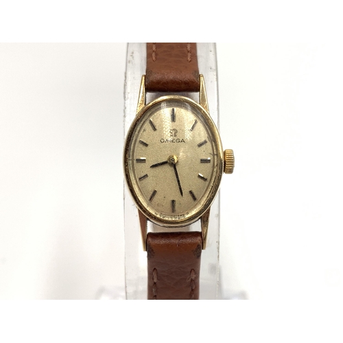 2164 - A vintage Omega 9ct gold cased hand wind lady's wristwatch