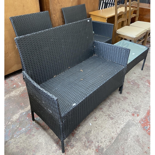 173 - Three pieces of plastic rattan effect garden furniture, one two seater love seat, one two seater sof... 