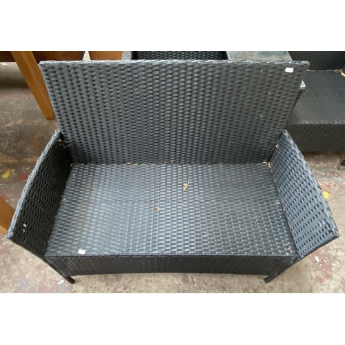 173 - Three pieces of plastic rattan effect garden furniture, one two seater love seat, one two seater sof... 