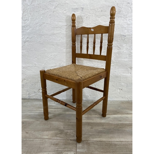 175 - Five pieces of furniture, four pine and rush seated dining chairs and one wicker basket