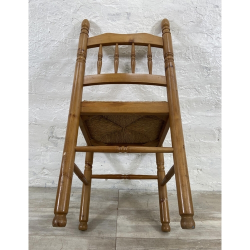 175 - Five pieces of furniture, four pine and rush seated dining chairs and one wicker basket