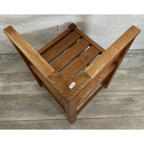 80 - Four teak outdoor corner chairs - approx. 74cm high