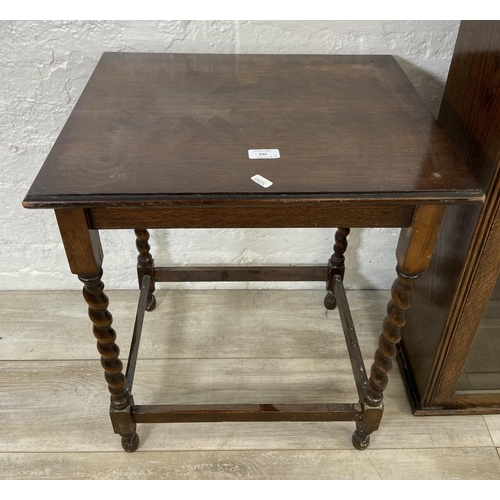 193 - Two pieces of oak furniture, one early 20th century glazed book case top and one barley twist side t... 