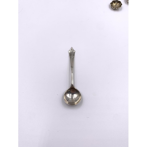 2248A - Five pieces of hallmarked sterling silver tableware, three condiment spoons, one pepper shaker and o... 