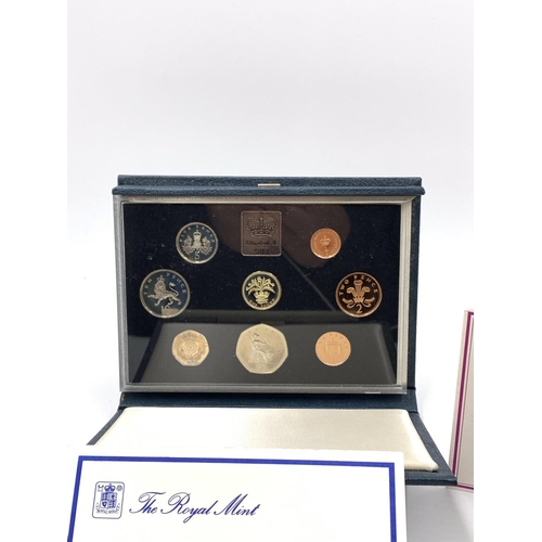 2260 - A collection of coins to include approx. 160g of British 92.5% silver shillings, cased 1984 Royal Mi... 