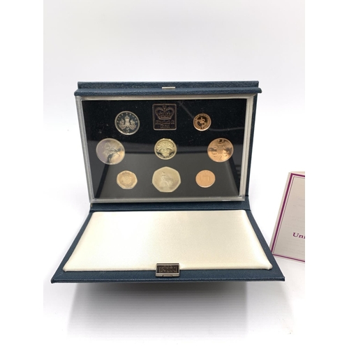 2260 - A collection of coins to include approx. 160g of British 92.5% silver shillings, cased 1984 Royal Mi... 