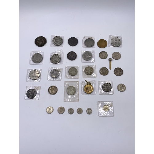 2261 - A collection of Victorian and later coins and medallions to include six .500 silver half crowns, thr... 