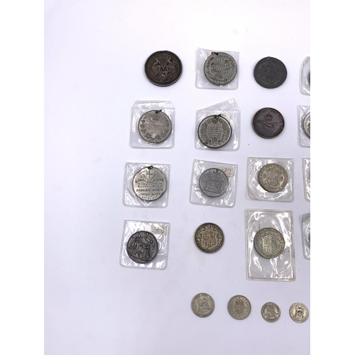 2261 - A collection of Victorian and later coins and medallions to include six .500 silver half crowns, thr... 