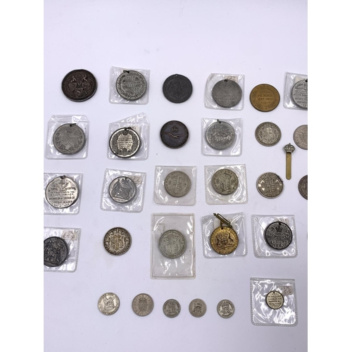 2261 - A collection of Victorian and later coins and medallions to include six .500 silver half crowns, thr... 