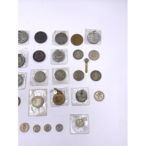 2261 - A collection of Victorian and later coins and medallions to include six .500 silver half crowns, thr... 