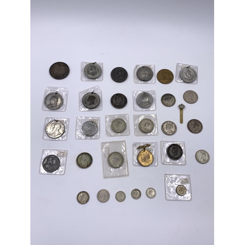 2261 - A collection of Victorian and later coins and medallions to include six .500 silver half crowns, thr... 