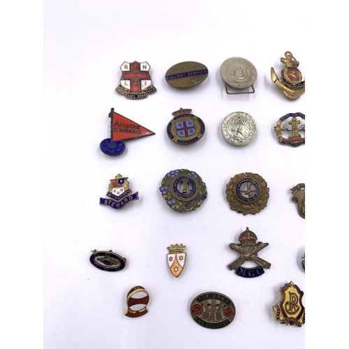 2271 - A collection of vintage badges to include Cheshire Regiment with silver rim, National Cycling Profic... 