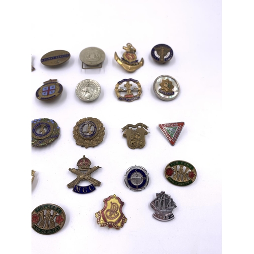 2271 - A collection of vintage badges to include Cheshire Regiment with silver rim, National Cycling Profic... 