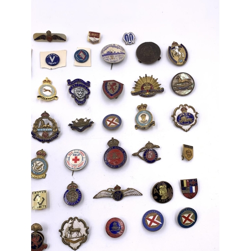 2273 - A collection of vintage badges to include RAF Bomber Squadron, Australian Commonwealth Military Forc... 