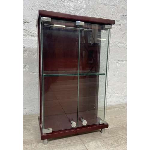 11 - A mahogany effect and glass two door jewellery cabinet - approx. 36cm high x 21.5cm wide x 13cm deep