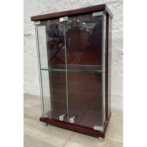 11 - A mahogany effect and glass two door jewellery cabinet - approx. 36cm high x 21.5cm wide x 13cm deep