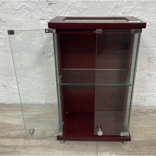 11 - A mahogany effect and glass two door jewellery cabinet - approx. 36cm high x 21.5cm wide x 13cm deep