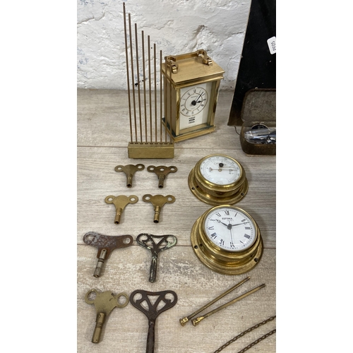 132 - A collection of clock and watch spares and accessories to include Metamec brass cased carriage clock... 