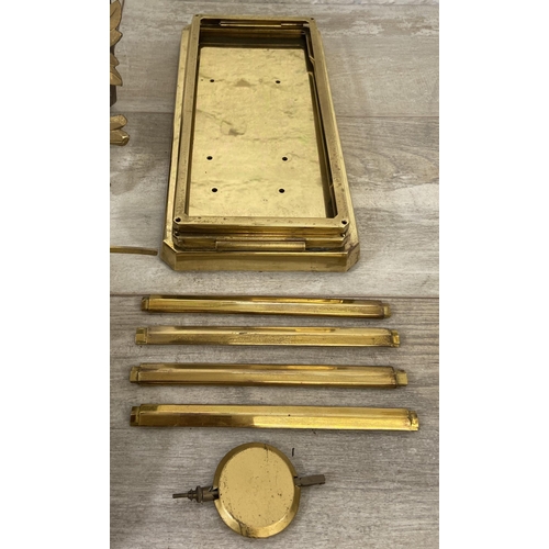 132 - A collection of clock and watch spares and accessories to include Metamec brass cased carriage clock... 