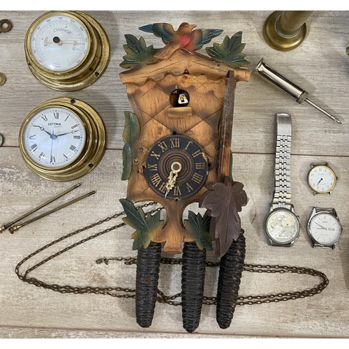 132 - A collection of clock and watch spares and accessories to include Metamec brass cased carriage clock... 