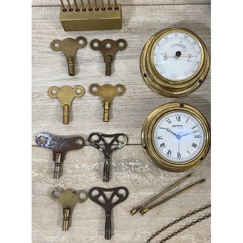 132 - A collection of clock and watch spares and accessories to include Metamec brass cased carriage clock... 